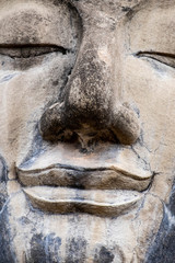 close up the face of monk statue