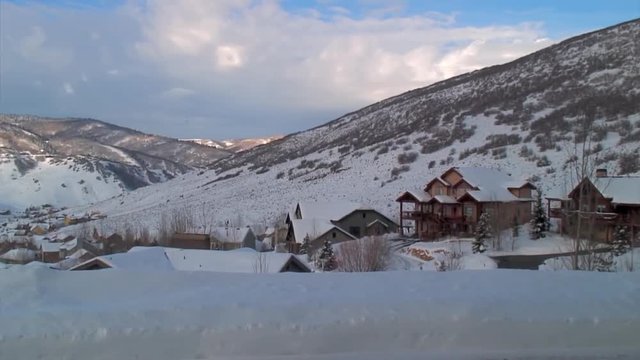 Zoom In: Snow-Covered Homes to Moose Herd