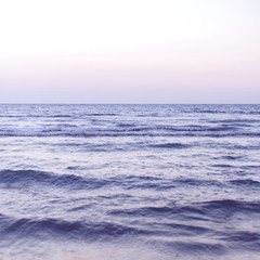 Fototapeta na wymiar Waves on a wide blue sea