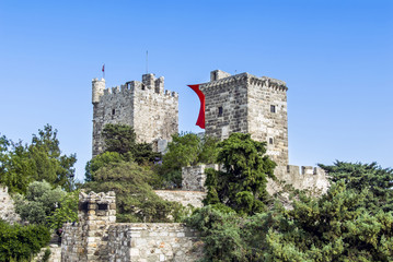 Fototapeta na wymiar Bodrum, Turkey, 19 May 2010: Bodrum Castle with Turkish Flag