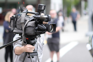 News cameraman on site at an event.