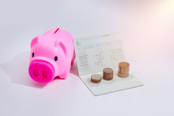 stack of coins and account book bank on the table