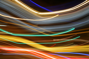 Streaks and lines form pattern of neon night lights.