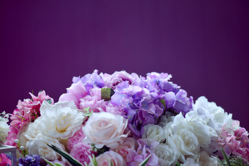 Bunch of flowers on a plain background. Top view. text space. selective focus