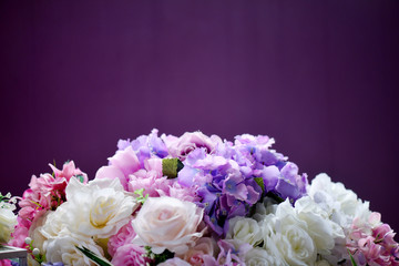 Bunch of flowers on a plain background. Top view. text space. selective focus