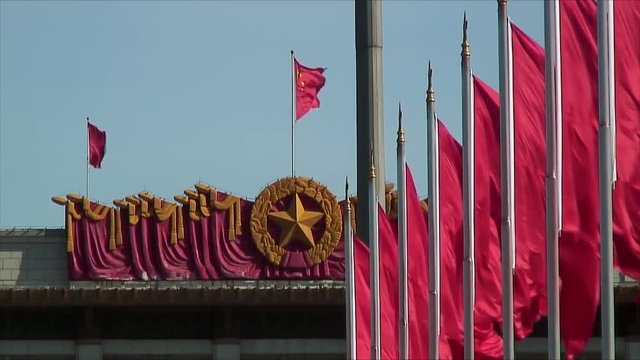 Red Flags Waving in the Wind and Decorative Center Stars