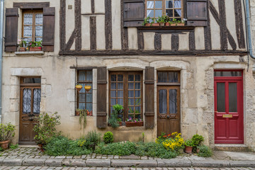 Obraz premium Noyers sur Serein, France May 17th 2013 : Beautiful timber framed cottage in Noyers sur Serein