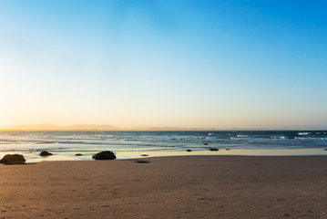 The sunset on the deserted beach in Byron Bay, Australia