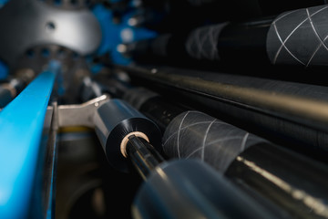 Ribbon slitter in a TTR wharehouse and production factory