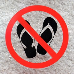 No footwear sign on a white stone background