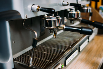 Fototapeta na wymiar coffee machine. professional modern restaurant or bar equipment. espresso cappuccino latte brewer. drink preparing process