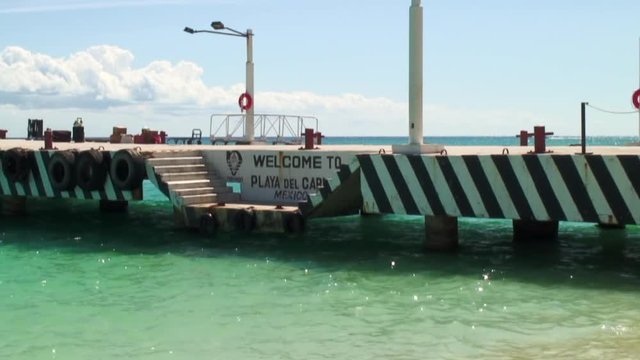 Sparkling Water and Welcome Sign on Pier
