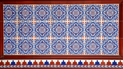 Ornate floral ceramic tiles typical of designs found on the frontage of traditional Chinese shop houses