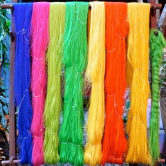 Skeins of colorful died hand spun silk hanging to dry