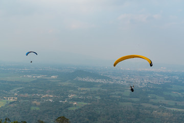 Paragliding in Mexico at dusk with a beautiful sky and contrast in the clouds