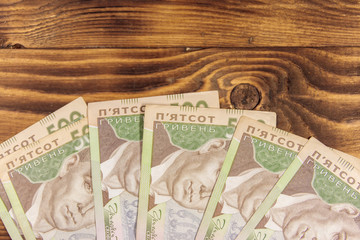 Ukrainian currency. Five hundred hryvnia banknotes on wooden desk
