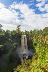 Landscape with a waterfall and clouds. Thompson Waterfall. Kenya, Africa