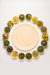 Indian sabzi / vegetable fried recipes served in white bowl over moody or colourful background. selective focus