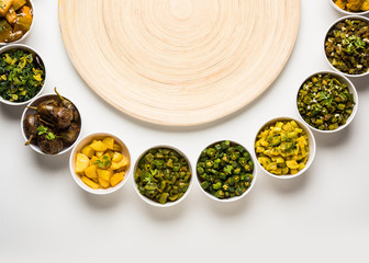 Indian sabzi / vegetable fried recipes served in white bowl over moody or colourful background. selective focus