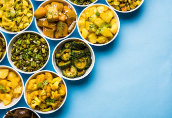 Indian sabzi / vegetable fried recipes served in white bowl over moody or colourful background. selective focus