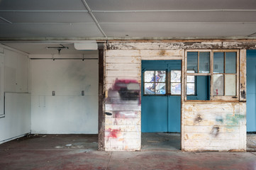 Fototapeta na wymiar Abandoned factory interior with door