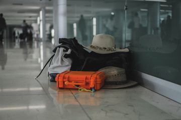 Luggage at an airport with hats bag and shockproof case