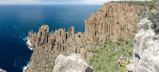 Panoramic, elevated view of Cape Raoul with its impressive formation of dolerite columns. Tasman National Park, Tasmania, Australia.