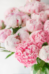 Beautiful bouquet of pink peonies . Floral composition, daylight. Wallpaper. Lovely flowers in glass vase.
