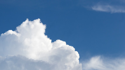 Blue sky with the white cloud in the sunny bright day