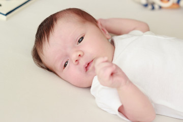 Portrait of a newborn baby laying on a blanket