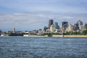 Gorgeous skyline of Montreal as seen across the St. Lawrence River on a sunny day. Montreal,...