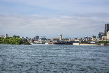 Gorgeous skyline of Montreal as seen across the St. Lawrence River on a sunny day. Montreal,...