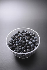 forest berry blueberry on a black background.
