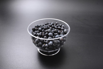 Fototapeta na wymiar forest berry blueberry on a black background.