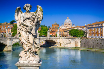 View from Ponte Sant Angel on Tiber in Rome, Italy. On the background the St. Peter Basilica in Vatican. Rome architecture and landmark.St Peter in Vatican city is the most important church of Rome