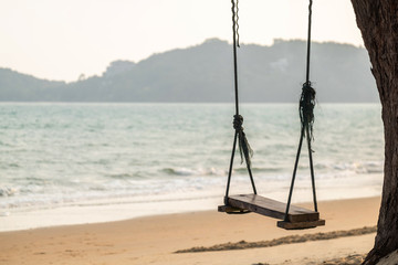 Simple Wood Plate Swing Near the Sea. Relax Time in the Vacation.