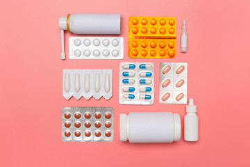 medicine pills on pink background. Top view