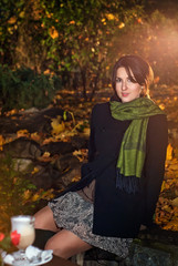 girl in the autumn evening with a scarf