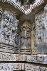 Fototapeta na wymiar Ornate bas relieif and sculptures of Hindu deities, Kedareshwara Temple, Halebid, Karnataka