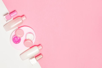 Pink decorative cosmetic on pink background.