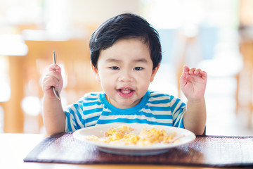 Asian baby eating a breakfast