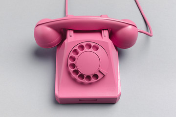 vintage phone on color background