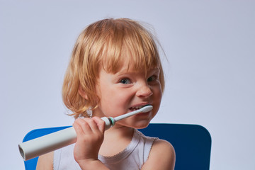 baby brushing her teeth