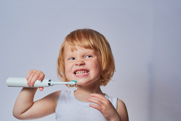 baby brushing her teeth