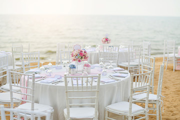 Wedding table setup at Beach Wedding Ceremony on the beach with sea and sky
