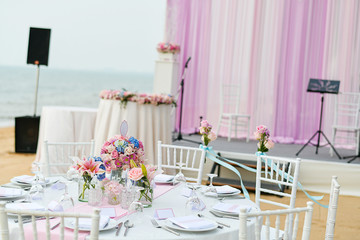 Wedding table setup at Beach Wedding Ceremony on the beach with sea and sky