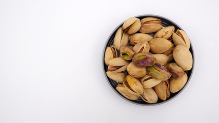 Pistachios on white background.It's green nut .