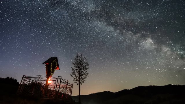 Milky way over cross and tree Time lapse
