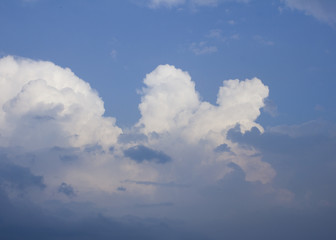 Naklejka na ściany i meble Beautiful cumulus clouds on blue sky background.