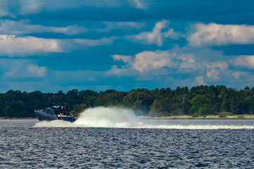 Fototapeta premium Grey motor yacht in move